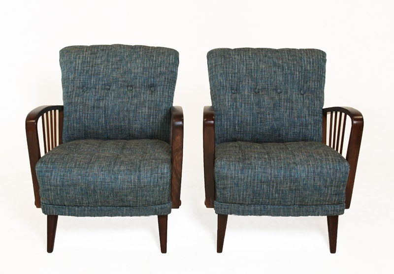 A pair of Danish chairs with great lines. Base is solid birch and the tufted seat has been upholstered with a teal tweed.

Seat depth measures 20.5