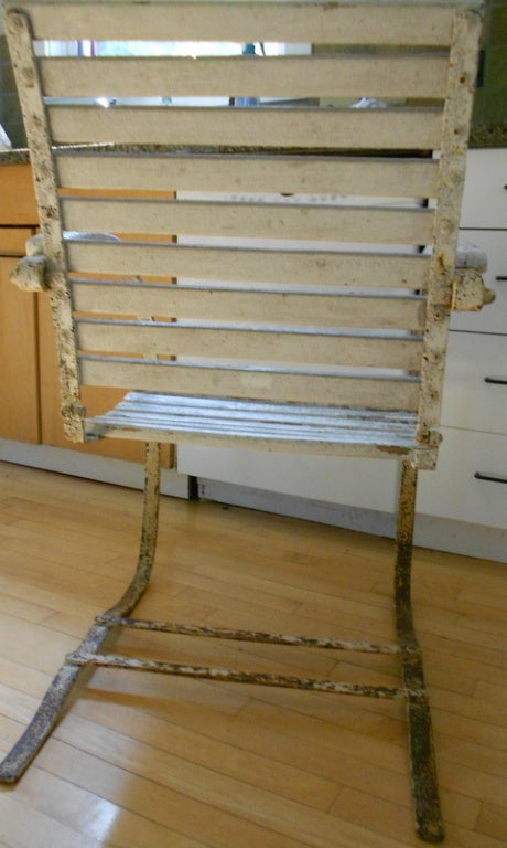 20th Century French country-style spring-back wooden and metal chair