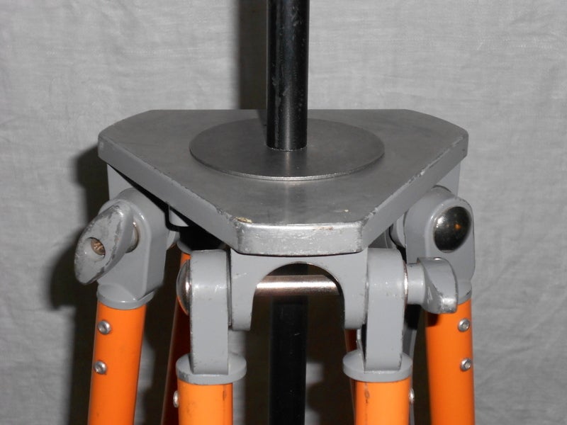 Surveyor Tripod of Orange-Painted Steel as Adjustable Floor Lamp 1