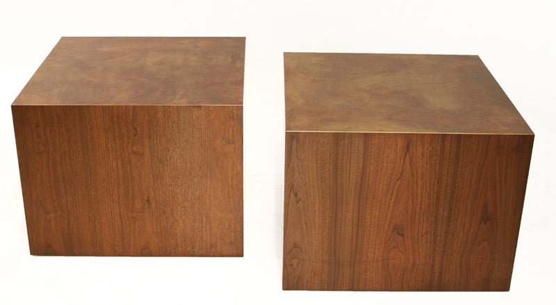A pair of beautifully grained Walnut cubes with bronze tops indicative of Harry Lunstead's style. Cubes could flank a sofa as large end tables. These are in excellent original condition with sharp corners. They have been waxed and hand rubbed but