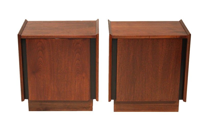 Pair of vintage Dillingham Esprit nightstands. The front of these nightstands swing open to reveal a shelf and white Formica backing. The doors are flanked by black formica strips.

 