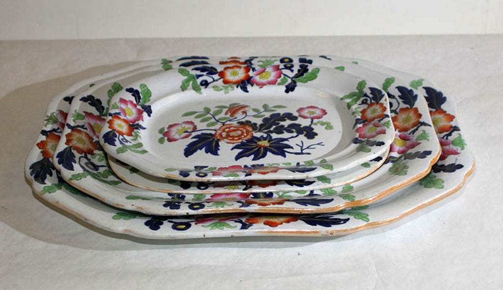EACH OCTOGONAL, PAINTED WITH FLOWERS AND LEAVES IN COLOR ENAMELS, WITH IMPRESSED MARK 