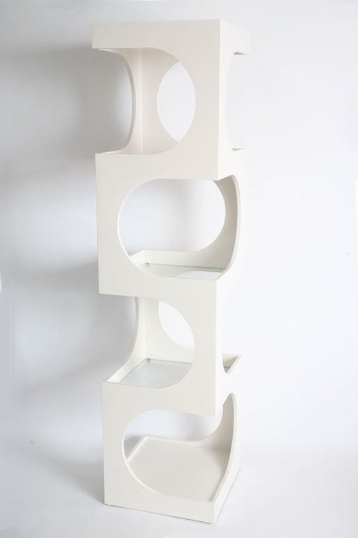 Geometric design etagere designed by Edward Wormley for Dunbar in white lacquered wood with three glass shelves and a solid bottom shelf. Completely restored to original specs.