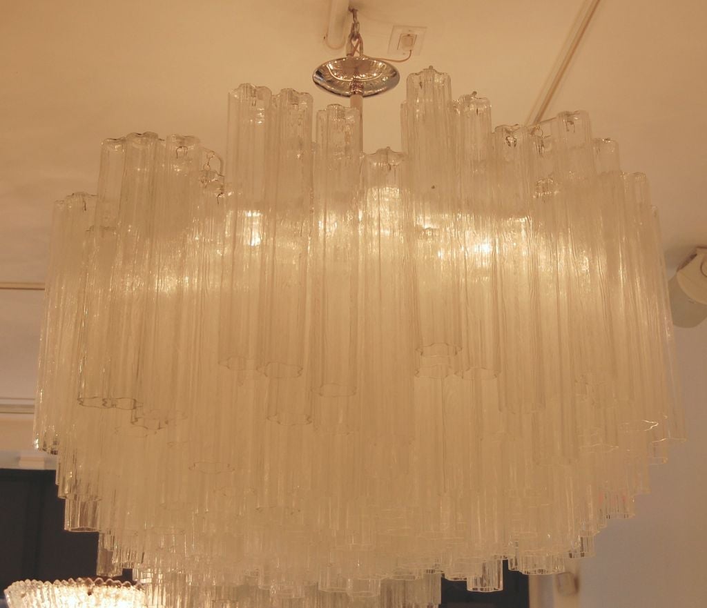 Venini Large Tubular Clear Glass Chandelier

Venini was founded in 1921 in the Italian glass making capital of Murano-- in truth an island in the waters surrounding Venice. Venini is still active to this day producing high quality lighting and