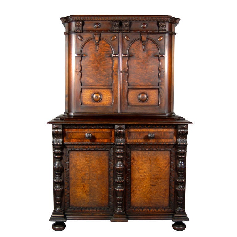 Victorian cabinet reflects the “Elizabethan” Revivalist style. Made of walnut it has ornate detailing and a fashionable framed faux mixed wood veneer on the doors. 



Made in grand rapids (metal label still intact on inside drawer).