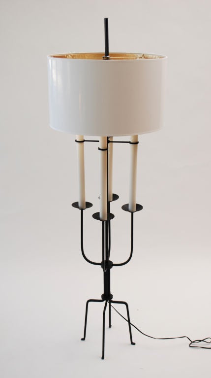 Floor lamp with four-light sockets by Tommi Parzinger.

Reference (similar form): Modern Americana: Studio Furniture From High Craft to High Glam, Iovine and Merrill, pg. 180.

Tommi Parzinger's meticulous detail in his early work as a silversmith