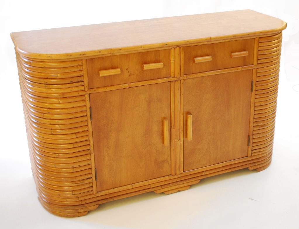 Fine & rare cabinet/server in the manner of Paul Frankl.  Cabinet has 2 drawers and two doors revealing a shelf.  *Notes: There is no sales tax on this item if it is being shipped out of the state of Florida (Objects20c/Objects In The Loft will need