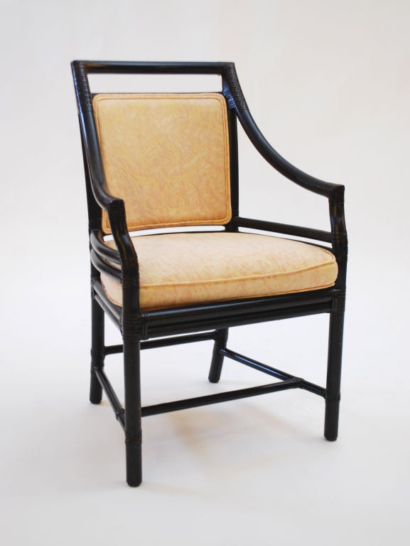 Set of 6 McGuire rattan arm chairs, some with brass tags.   Fortuny fabric.  ***Contact/Shipping Information: AOL (American Online) users may experience difficulties sending emails to us or receiving emails from us. If you have made an inquiry to us