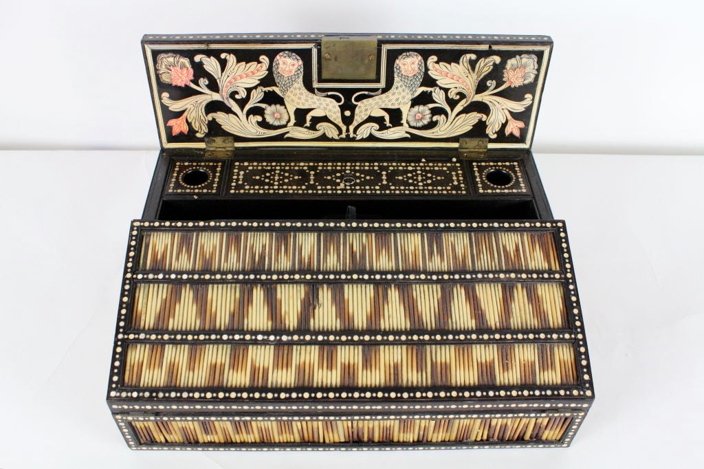 A rare 19th century Anglo-Indian quill box lap desk with double lion inlaid lid, and intricate detailed interior, great zig zag action to the quill. A very large and impressive piece.

 