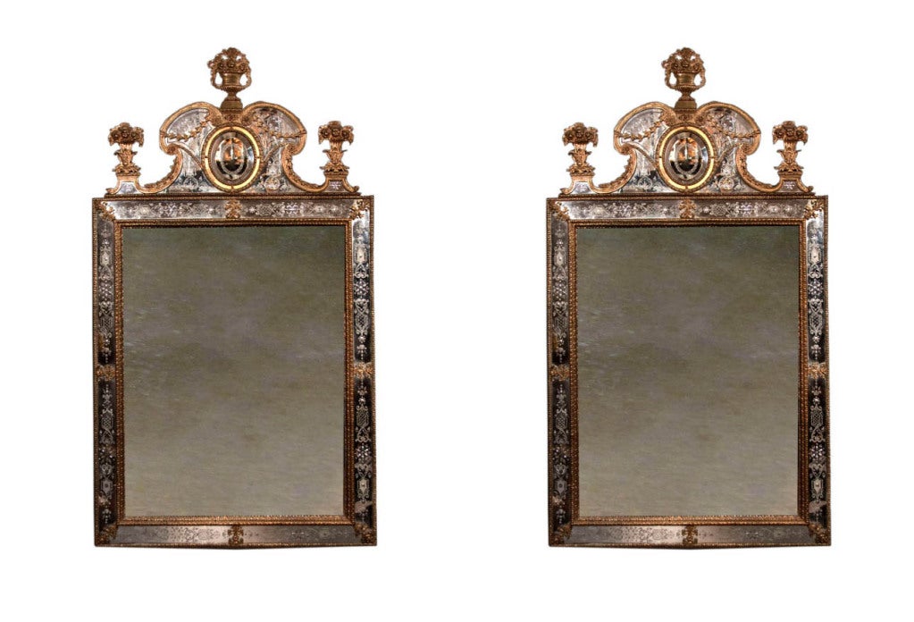 # V111 - Matched pair of Swedish, Baroque style gilt metal mirror. It was the renowned Swedish furniture maker, Gustav Precht, who first popularized this design. For similar examples see 