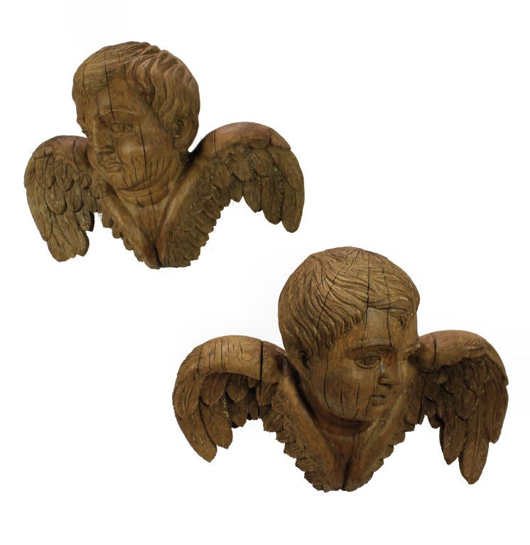 A Pair Of Large Iberian 18th Century Carved Walnut Cherubs