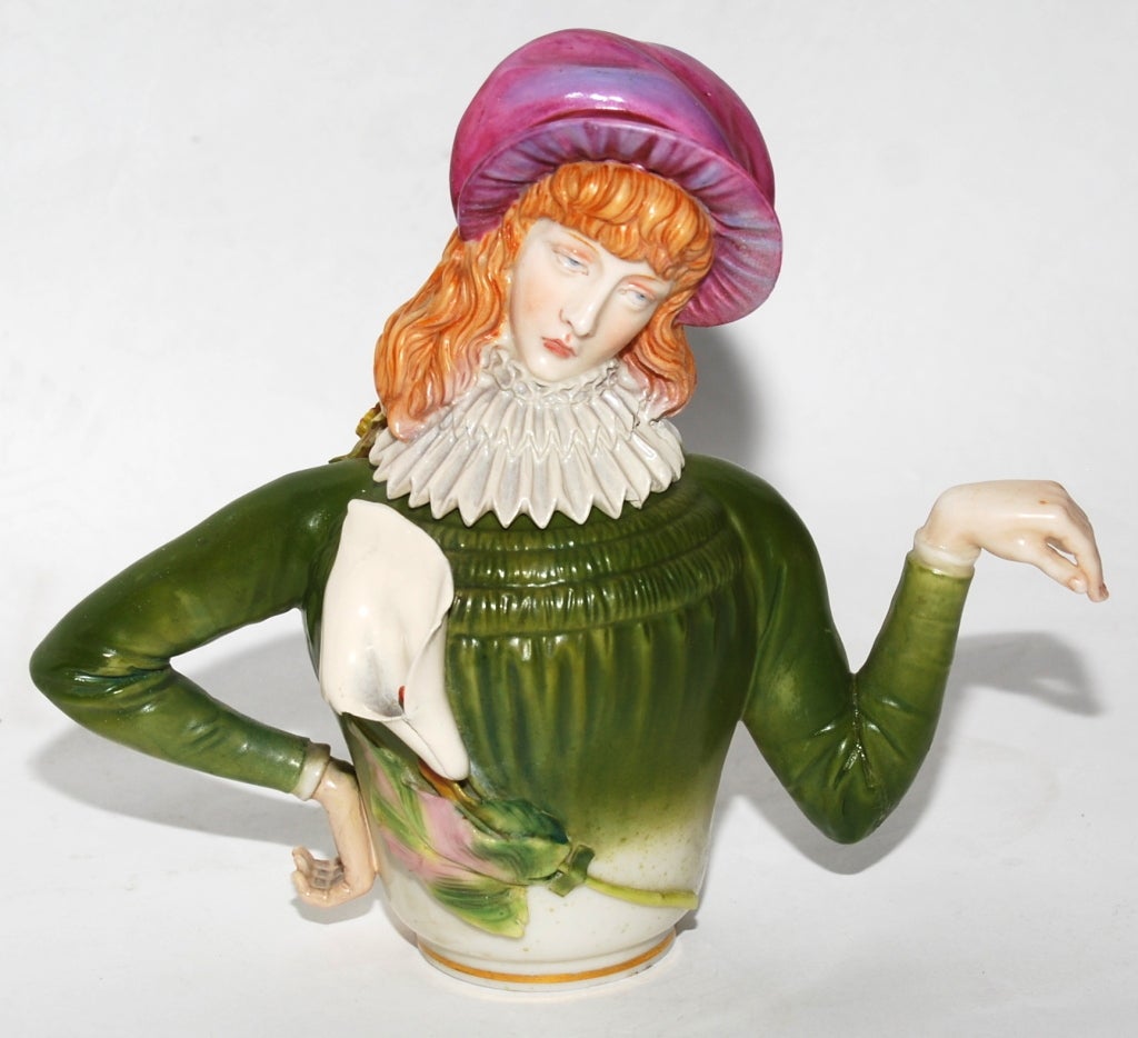 A Royal Worcester Porcelain 'Aesthetic' or 'Patience' teapot and cover.
Designed by R.W. Binns, Modeled by James Hadley.