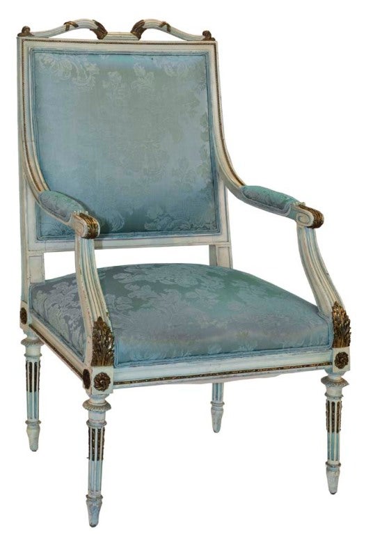 This beautiful French Empire chair crafted in the style of George Jacob has padded arms and cabriole legs with ornate gold carvings.