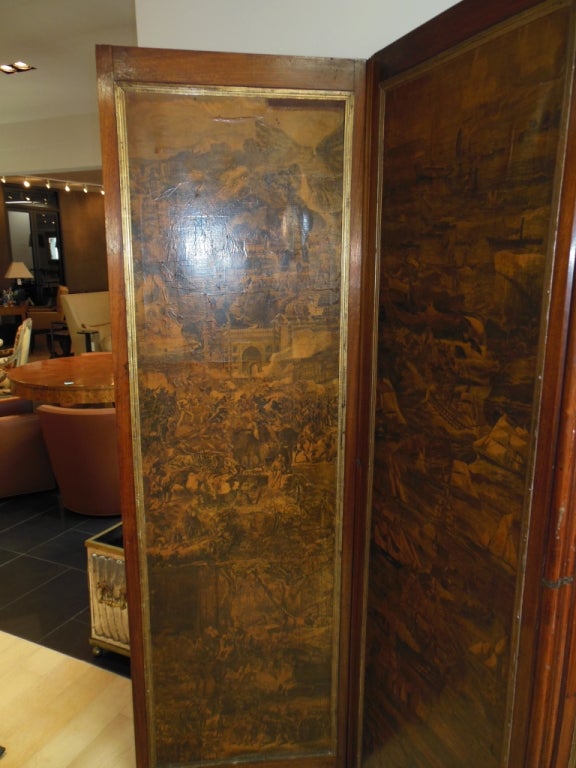 English yewood, decoupage panels have gilded filets, back of screen is reupholstered in tan suede cloth. Each panel depicts a different scene. Military scene, Maritime scene, Pastoral scene, and a Hunting scene. Screen is unusual because it is