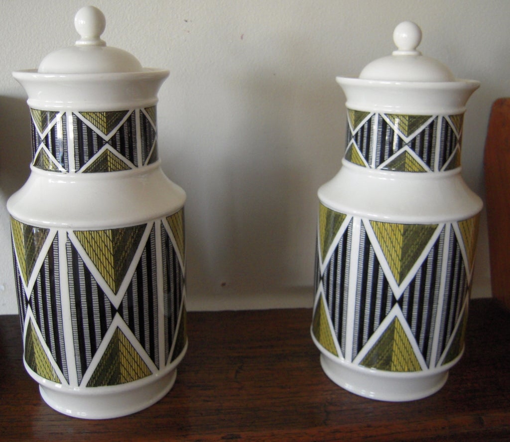 Pair of rare Wedgwood Queensware pottery 'Design 63' covered canisters,  with designs by Robert Minkin, of cylindrical form  with printed geometric pattern in yellow and black, reminiscent of contemporary art and African textiles, with dome shaped