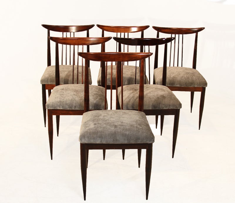 Set of six Rosewood spindle back dining chairs attributed to Giuseppe Scapinelli with curved sculptural back rests and elegantly tapered legs. The bases have been refinished and the seats upholstered in a silver-blue silk velvet upholstery.
Seat
