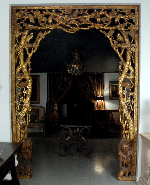 An Important Architectural Carved Giltwood Room Surround depicting many carved birds within a tree and vine motif