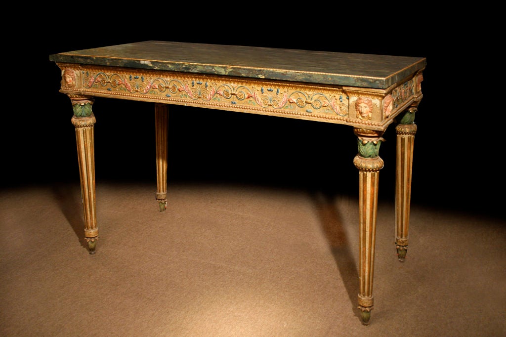 # F750 - A very fine Italian carved and gilt console table. It is rare to find examples of this period with such attention to fine detail. Of special note is the well preserved polychrome colors and gilding. The table was made in the Piedmont area