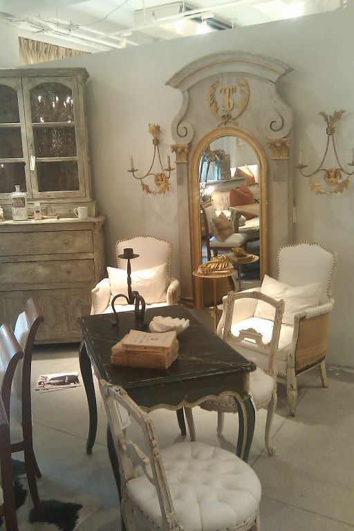 Impressive french architectural fragment with marbelized painted wood and gilded frame.  The piece maintains its original marbelized grey paint and gilt. Entertwined 