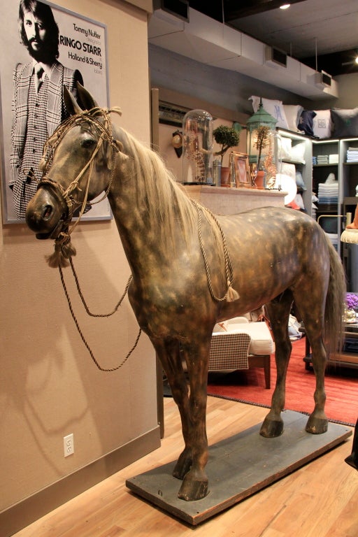 American Harness Horse c. 1890 of Papier-mâché and tin with glass eyes, cast iron ears and original paint, horse hair tail and mane. Used to display saddles and harness in front of a tack shop. Bridal not included.