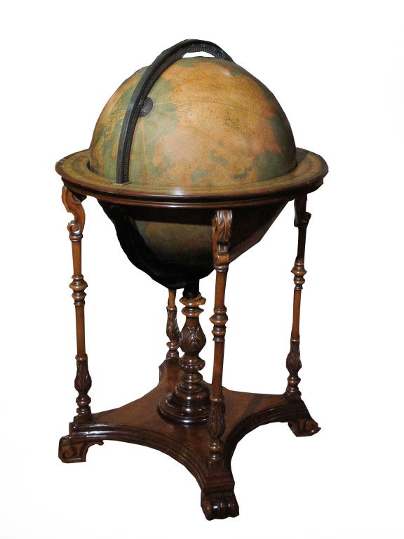 Kittinger terrestrial library globe on a handsome carved mahogany stand. The printed gores with states and countries in different colors.  Analemma table, brass hour circle at the pole, paper on wood horizon rings with signs of the zodiac and