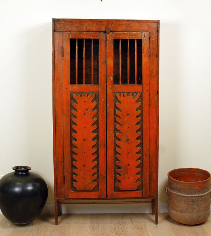 A wonderful 19th century New Mexican painted trastero with painted spindles, deeply carved paneled doors and bracket feet. Original paint with excellent wear and patina commensurate with age. Northern New Mexico - circa 1880.

Dimensions: 65