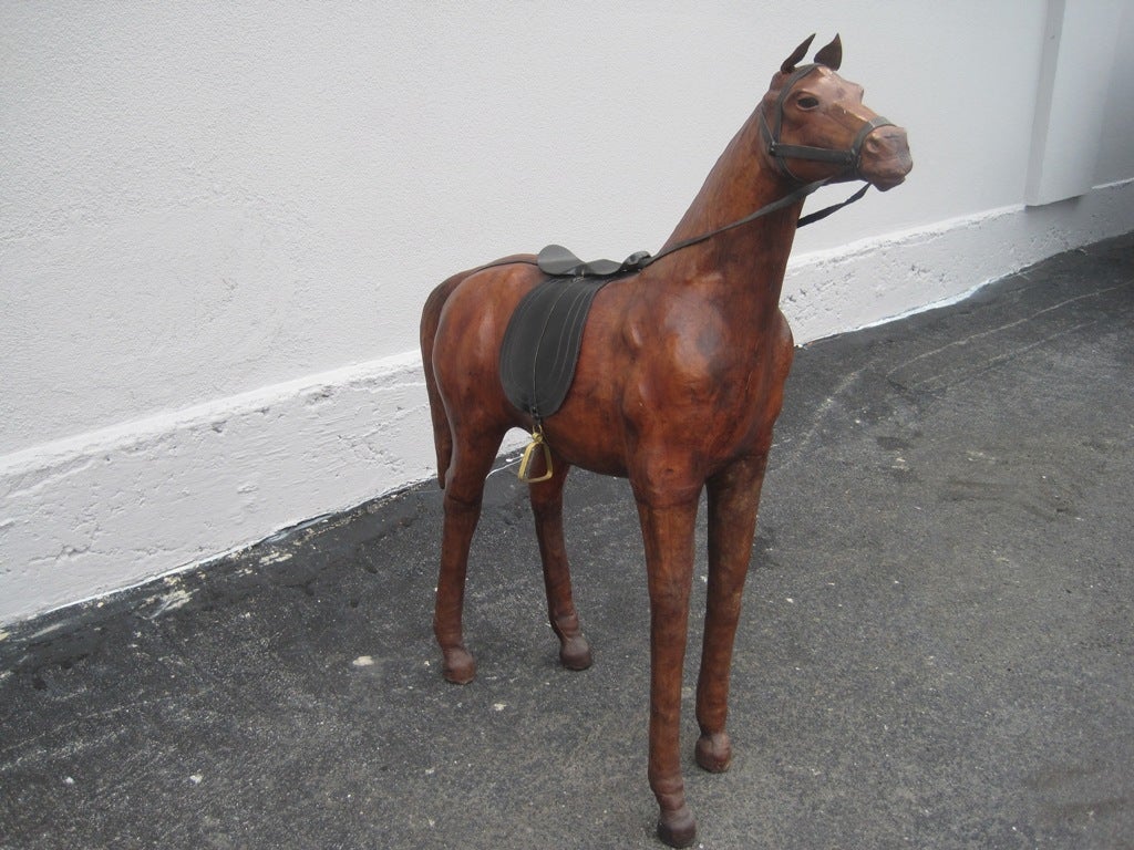 (The Sale Will Apply to Our Selection of Horses of at least 20%) Abercrombie and Fitch large leather horse sculpture with glass eyes. Unmatched pair available, will discount when purchased as a pair, 2nd leather horse shown in image 2, 7 and