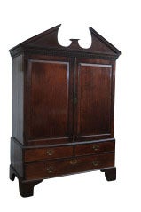 English mahogany linen press, two doors over three drawers with broken pediment.

Originally $8,750.00.