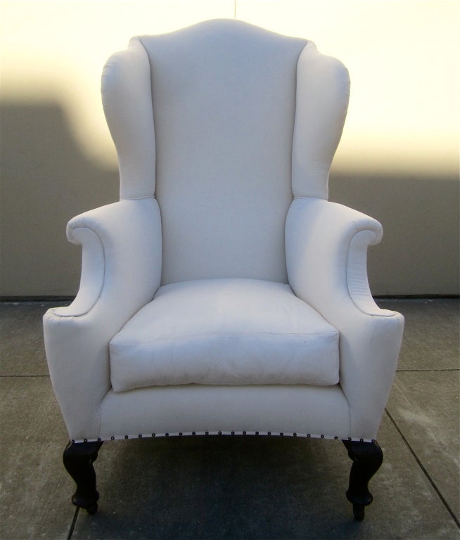 A beautifully scaled high back wing back chair newly upholstered on a simple muslin. Comfortable beyond your wildest imagination.

Arm height: 28