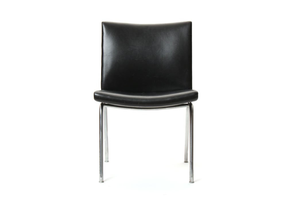 A pair of original black leather and chromed steel 'Airport' chairs.
