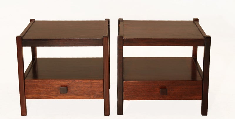 Pair of caviuna wood side tables or nightstands featuring a single drawer with ebonized square pulls. 

Many pieces are stored in our warehouse, so please click on 