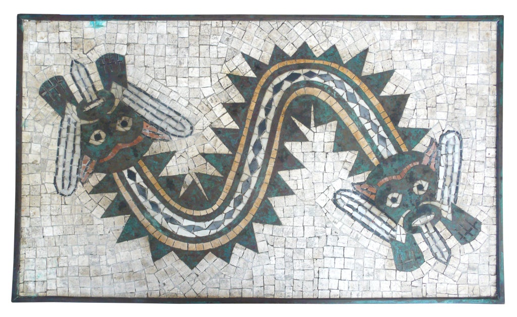 An extraordinary and wonderful example of 20th century, Mexican Modernism. A mosaic top of cut stone and patinated copper depicting an abstract, double-headed Aztec serpent. The mosaic is set in a patinated copper frame with a concrete foundation