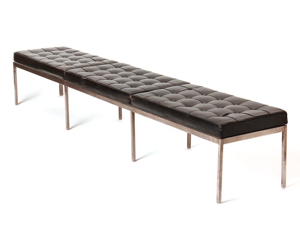 A long three-cushion satin chrome bench with the original tufted black leather cushions.