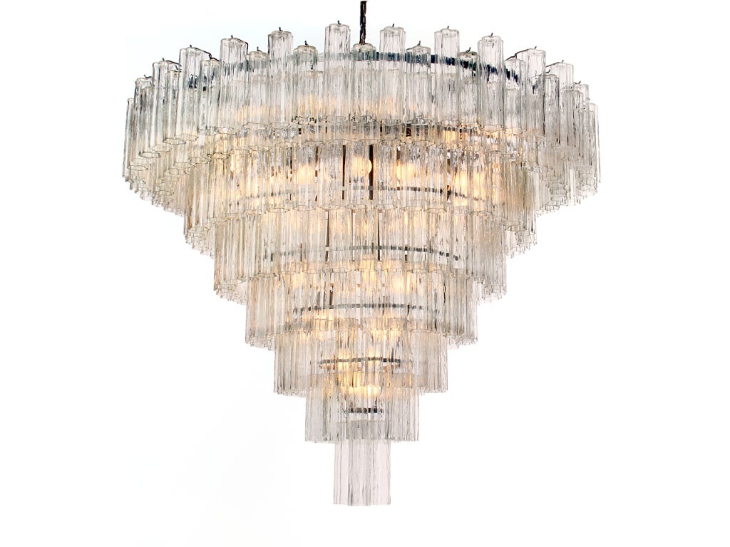 A fine and dramatic large-scaled Murano glass chandelier made by Venini. Eight (8) tiers of textured hollow 