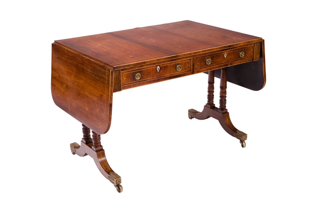 Fine Regency mahogany sofa table inlaid with boxwood, with brass hardware. 41