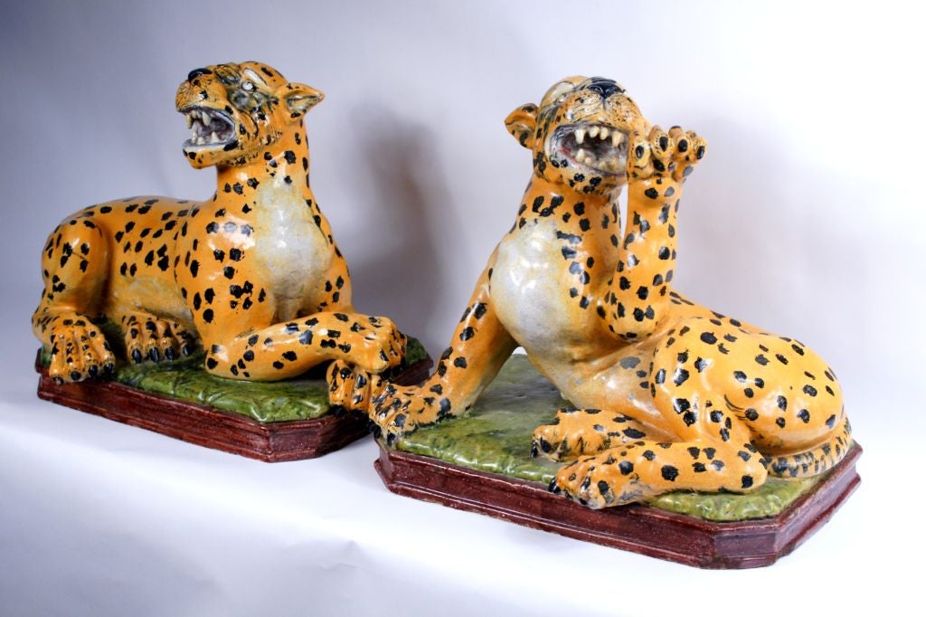 Each modeled as a reclining Leopard snarling.