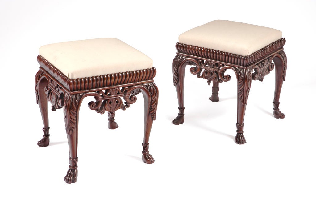 A pair of unusual 19th century upholstered mahogany benches.