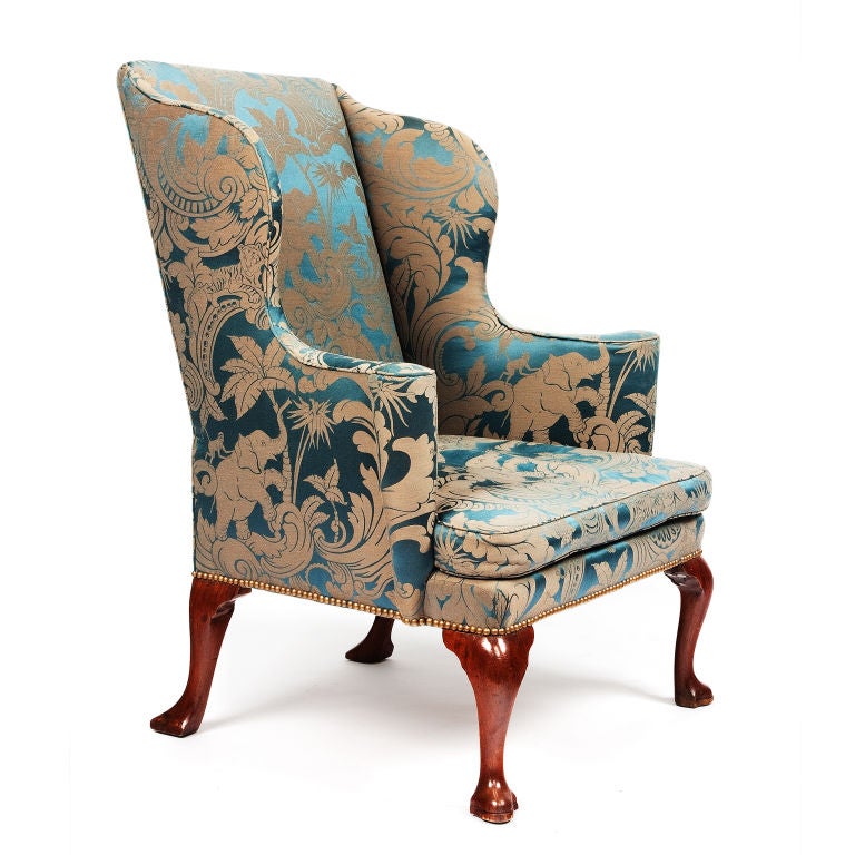 George I upholstered wingback armchair.