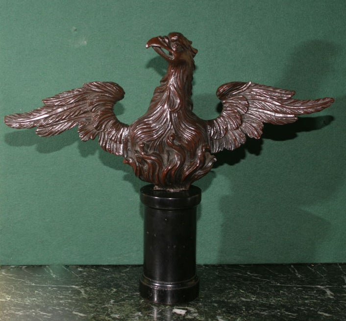 Fine Antique Mahogany Carving of an Upright Outstretched Winged Eagle, the wonderfully detailed carving shows an excellence of workmanship and brings out the richness and beauty of the mahogany. On custom-made modern ebonized wood stand, American or