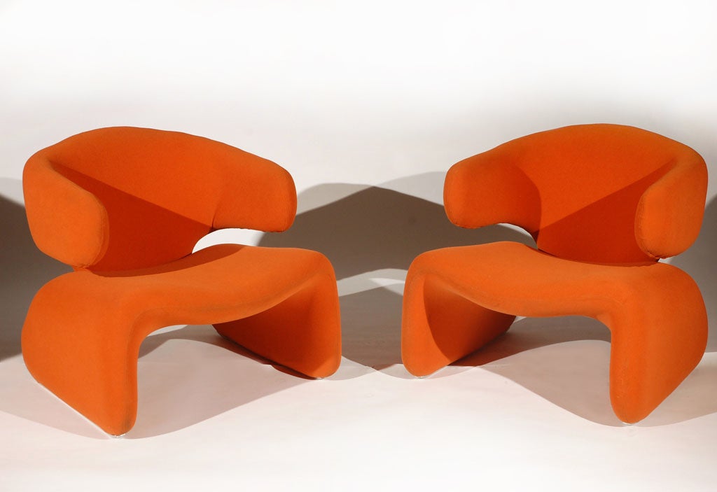 A Pair of Sculptural Chairs by Olivier Mourgue. FRA, 1970s. A Pair of sculptural wingback armchairs evocative of Pierre Paulin's work for Artifort. Upholstered in the original orange wool crepe. Aluminum runners on both legs. Excellent original