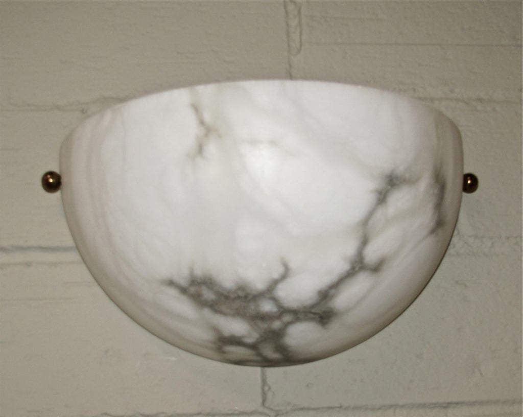 Pair of alabaster wall sconces by Lightolier. Rewired.