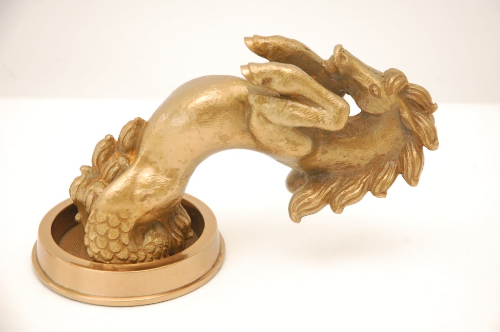 This pair of cast bronze door pulls by Vadim Androusov features stylized rearing seahorses on a backplate. Mounts through the backplate.  Androusov collaborated with French designer Andre Arbus creating unique hardware.
