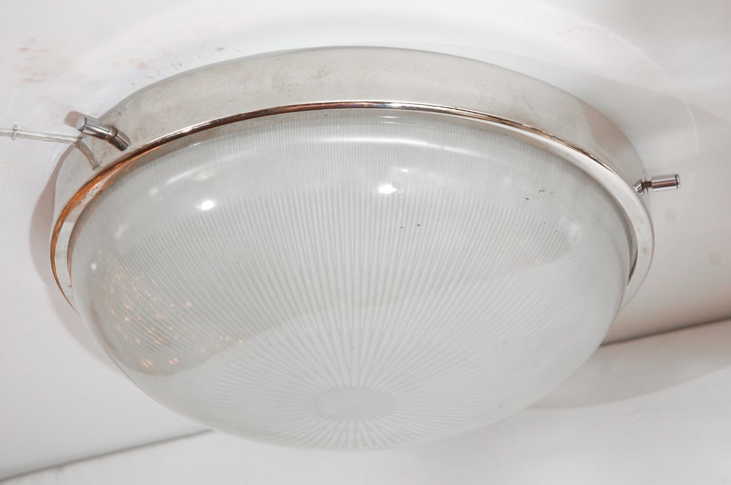 Elegant Sergio Mazza flush mount with internal ribbed opaque glass domes resting in polished nickel hardware with nickel peg detailing. Newly re-wired.