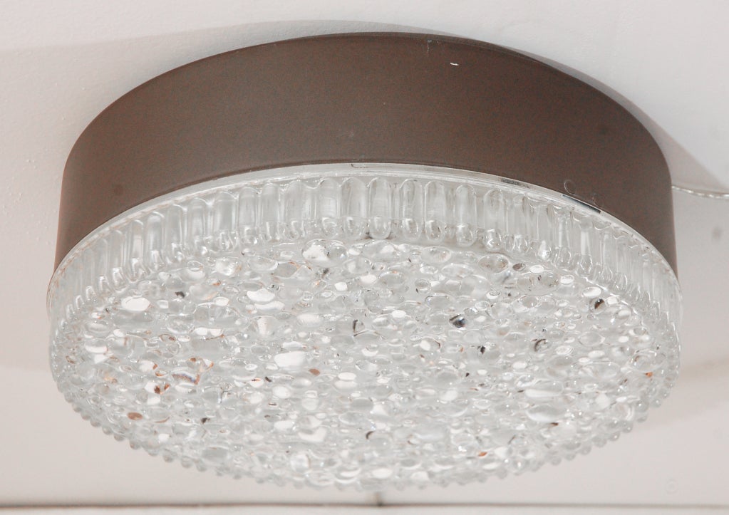 Beautiful thick detailed bubble glass flush mount with ribbed edges on deep black fixture. Professionally re-wired. 6 available and sold individually.