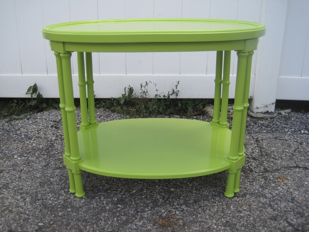 Gorgeous single Two-tier faux bamboo lime green dual posts oval gueridon occasional table, in the manner of T.H. Robsjohn-Gibbings.