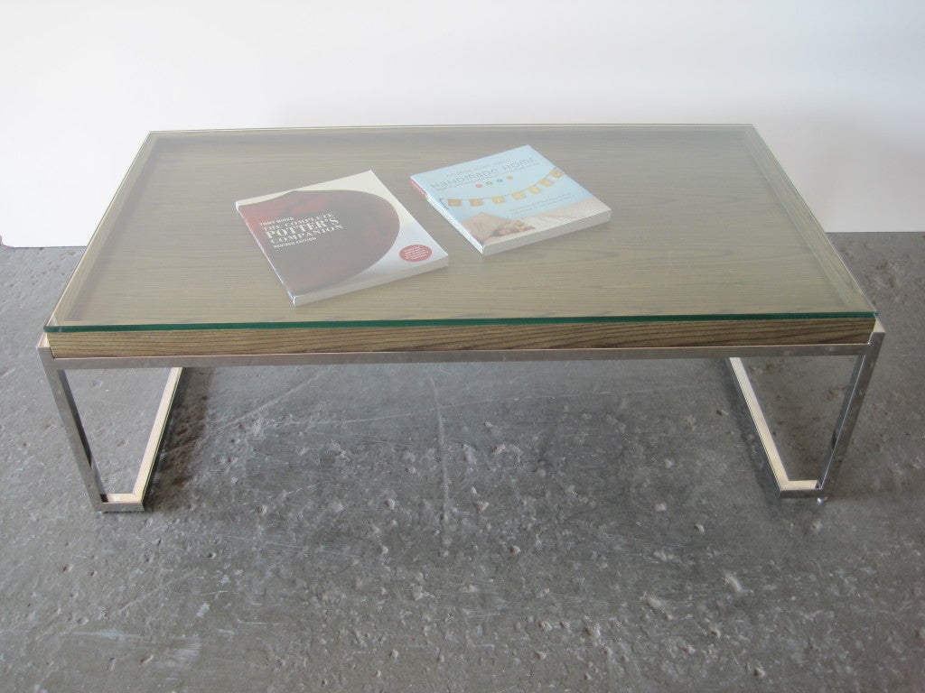 Mid-Century Modern low cocktail table after Milo Baughman, with display for valuables, books, magazines and trinkets with adjustable legs, this item is on sale for a clearance price.