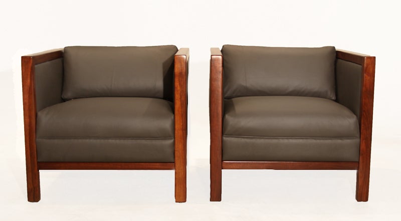 Pair of square walnut and gray leather club chairs with upholstered side panels. Attributed to Milo Baughman.

Seat depth measures 19