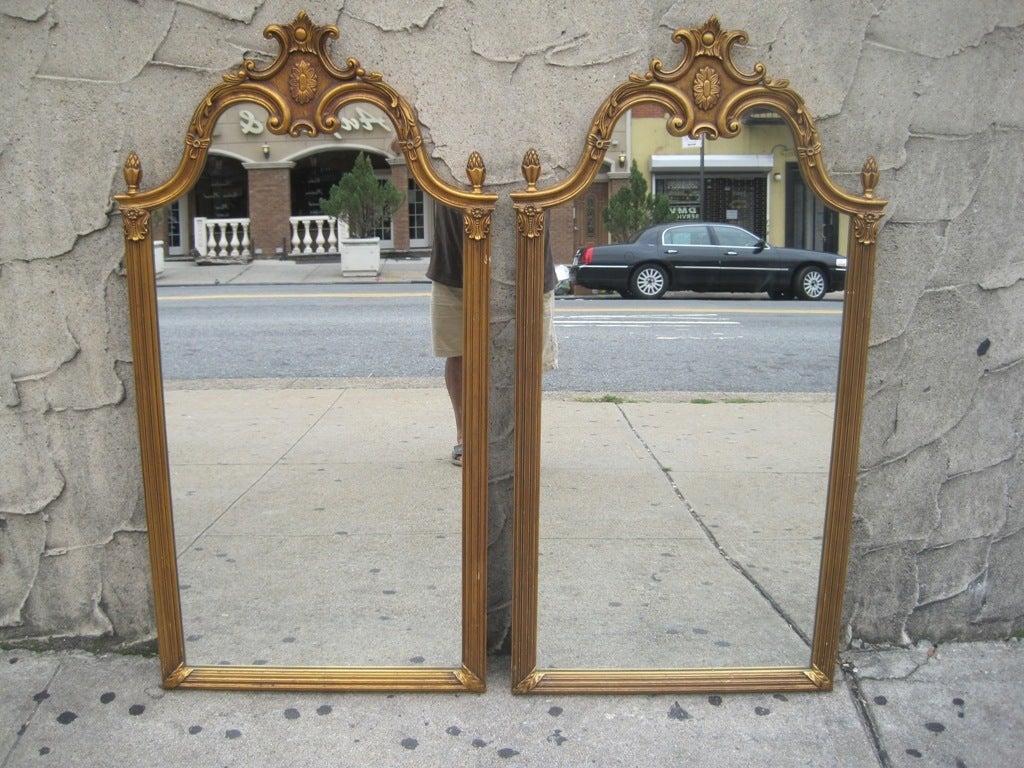 Pair of tall regency mirrors with gold gilt frames.