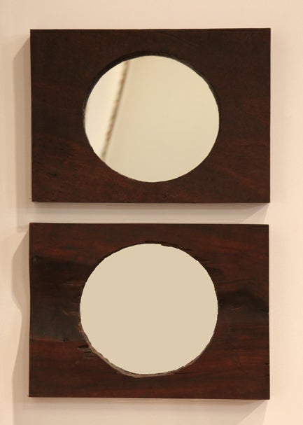 A pair of circular mirrors framed in a rustic Brazilian Reclaimed Ipe wood. Maintains a natural wood feel.

 