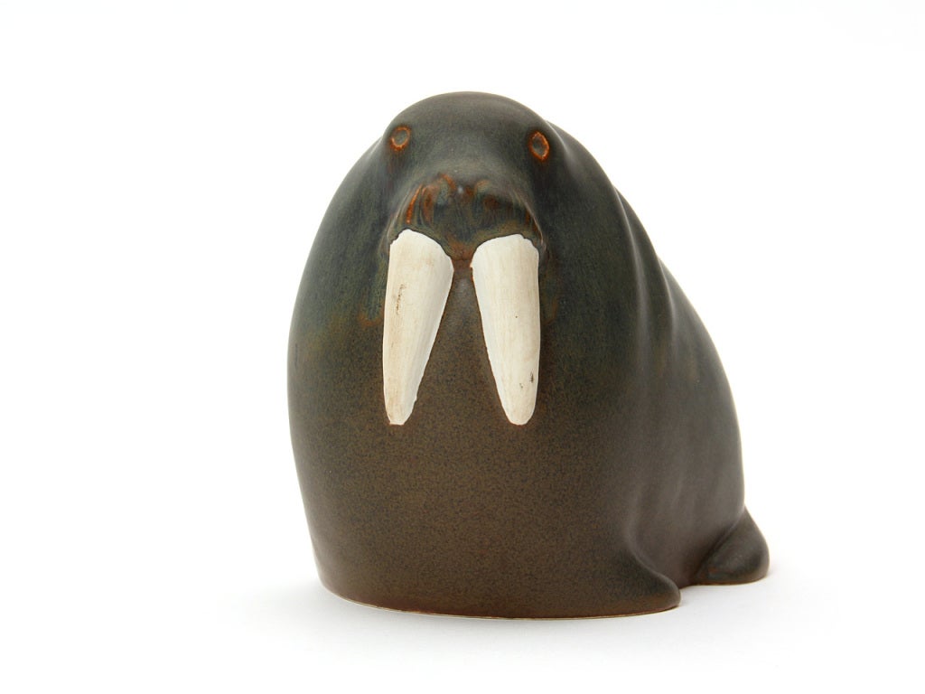 An expressive and well-modeled ceramic walrus having a rich blue-to-grey-to-brown matte glaze.